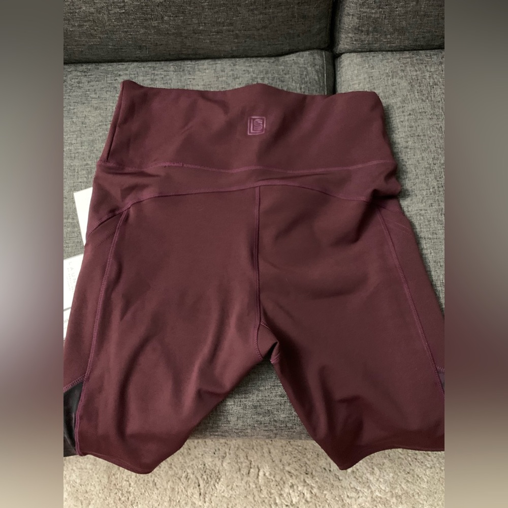 NWT Plum biker shorts with lace design.